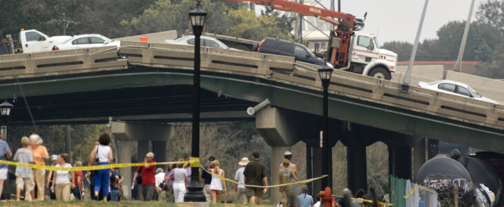 collapsed overpass bridge with cars on it